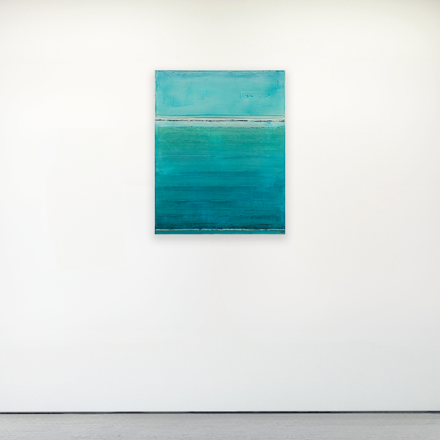 Abstract painting with teal and gray colors on a white wall