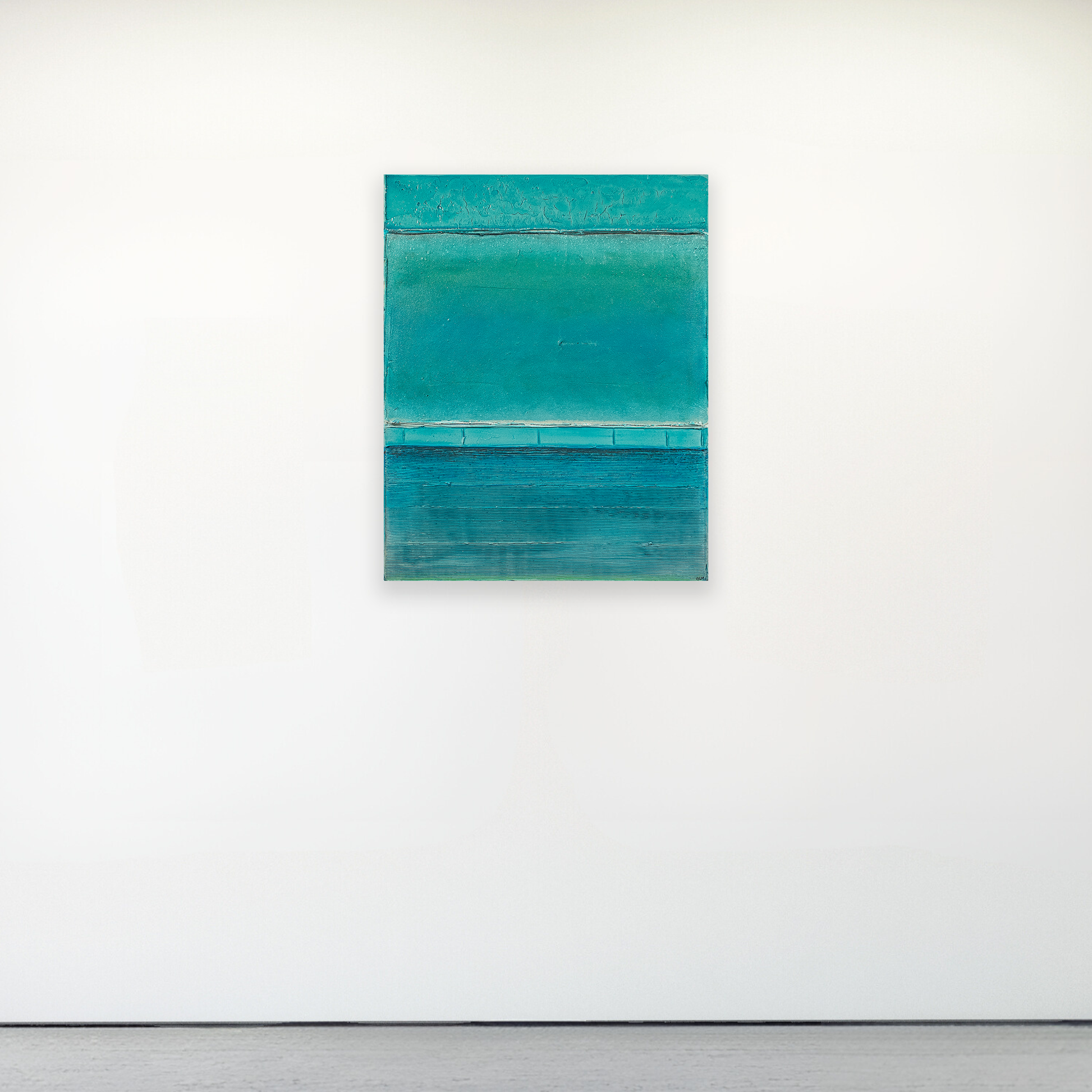 Abstract teal painting on a white wall